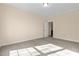 Spacious carpeted bedroom with neutral walls and natural light, ready for personalization and comfort at 406 Stewart Town Rd, Lillington, NC 27546
