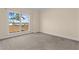Bedroom with neutral carpet and a large window, providing ample natural light and outdoor views at 406 Stewart Town Rd, Lillington, NC 27546
