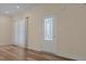 Bright entryway with a decorative glass front door and wood-look flooring, offers a warm welcome at 406 Stewart Town Rd, Lillington, NC 27546