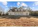 Charming home featuring a welcoming front porch and dormer windows under a blue sky at 406 Stewart Town Rd, Lillington, NC 27546