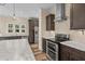 Modern kitchen with stainless steel appliances, granite countertops, and custom cabinetry at 406 Stewart Town Rd, Lillington, NC 27546