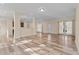 Expansive living area featuring wood-look floors, lots of windows, and an open concept design at 406 Stewart Town Rd, Lillington, NC 27546
