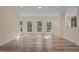 Spacious living area filled with natural light, beautiful wood-look floors and neutral tones at 406 Stewart Town Rd, Lillington, NC 27546