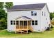 Back exterior view of home featuring a screened porch, providing an ideal space for outdoor relaxation and entertainment at 456 Barbour Farm Ln, Four Oaks, NC 27524