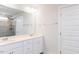 Elegant bathroom featuring double sink vanity, quartz countertop, and frameless glass shower with stone tiling at 456 Barbour Farm Ln, Four Oaks, NC 27524