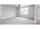 Large bedroom with carpeted floors, ceiling fan, and double-hung windows at 456 Barbour Farm Ln, Four Oaks, NC 27524