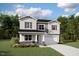 Charming two-story home featuring a two-car garage, well-maintained landscaping, and beautiful architectural details at 456 Barbour Farm Ln, Four Oaks, NC 27524