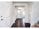 Inviting foyer with hardwood floors, neutral paint, and access to other rooms at 456 Barbour Farm Ln, Four Oaks, NC 27524