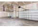 Spacious three-car garage with unfinished drywall, ready for customization and ample vehicle storage at 456 Barbour Farm Ln, Four Oaks, NC 27524