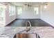 Open concept kitchen with granite counters, stainless steel sink, and pendant lighting, leading to living area at 456 Barbour Farm Ln, Four Oaks, NC 27524