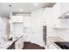 Spacious kitchen with granite countertops, stainless steel appliances, white cabinets, and a center island at 456 Barbour Farm Ln, Four Oaks, NC 27524