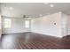 Hardwood floored living room with ample natural light and recessed lighting, ceiling fan, and neutral paint at 456 Barbour Farm Ln, Four Oaks, NC 27524