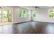 Bright living room featuring hardwood floors, ceiling fan, recessed lighting, and natural light from many windows at 456 Barbour Farm Ln, Four Oaks, NC 27524