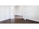 Spacious living area with dark hardwood floors, white trim, and lots of natural light at 456 Barbour Farm Ln, Four Oaks, NC 27524