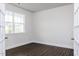Well-lit home office featuring neutral paint, hardwood floors, and natural light at 456 Barbour Farm Ln, Four Oaks, NC 27524