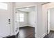 Bright, light-filled home office space with dark hardwood flooring and white trim at 456 Barbour Farm Ln, Four Oaks, NC 27524
