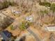 Aerial view of the property showcasing mature trees and the surrounding landscape, offering privacy at 4664 Quarter Creek Ln, Liberty, NC 27298