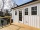 Back deck with metal railings, overlooks the backyard, and has white siding at 4664 Quarter Creek Ln, Liberty, NC 27298