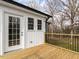 Back deck with metal railings, overlooks the backyard, and has white siding at 4664 Quarter Creek Ln, Liberty, NC 27298