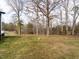 Expansive backyard with mature trees, providing shade and privacy at 4664 Quarter Creek Ln, Liberty, NC 27298