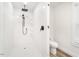 Modern bathroom with a stand-up shower, a black shower head, and a white toilet at 4664 Quarter Creek Ln, Liberty, NC 27298