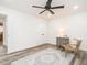 Bright bedroom featuring a ceiling fan, white walls, and a decorative rug and vintage furnishing at 4664 Quarter Creek Ln, Liberty, NC 27298