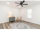 Bright bedroom featuring a ceiling fan, white walls, and a decorative rug and vintage furnishing at 4664 Quarter Creek Ln, Liberty, NC 27298