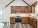 Updated kitchen featuring wood cabinets and stainless steel appliances at 4664 Quarter Creek Ln, Liberty, NC 27298