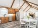 Open-concept kitchen featuring stainless steel appliances and a dining area at 4664 Quarter Creek Ln, Liberty, NC 27298