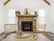 Cozy living room featuring a stone fireplace and charming decor at 4664 Quarter Creek Ln, Liberty, NC 27298