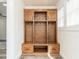 Mudroom with custom wooden storage lockers and shelving providing practical organization at 4664 Quarter Creek Ln, Liberty, NC 27298