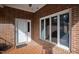 Close-up view of a home's entryway showcasing a white front door and brick facade at 4701 Morehead Dr, Raleigh, NC 27612