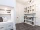 Mudroom featuring custom shelving, a bench, and ample storage space at 49 Clear Springs Ct, Pittsboro, NC 27312