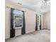 Bedroom featuring carpet floors, neutral walls, and bright windows with views to the front yard at 5416 Kissimmee Ln, Raleigh, NC 27616