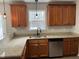 Kitchen featuring wood cabinets, granite countertops, and stainless steel appliances at 5663 Godwin Lake Rd, Benson, NC 27504