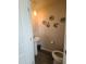 Cozy half-bath with pedestal sink and decorative wall art at 5943 River Landings Dr, Raleigh, NC 27616