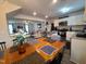 Open-concept dining area with a view to the kitchen and living room at 5943 River Landings Dr, Raleigh, NC 27616