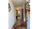 Inviting foyer with hardwood floors, decorated shelves, and a view into the home at 5943 River Landings Dr, Raleigh, NC 27616