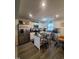 Bright kitchen with stainless steel appliances, kitchen island, and granite countertops at 5943 River Landings Dr, Raleigh, NC 27616