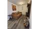 Cozy living room featuring a comfortable couch, stylish decor, and modern flooring at 5943 River Landings Dr, Raleigh, NC 27616