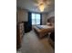 The main bedroom features a queen-sized bed and a ceiling fan at 5943 River Landings Dr, Raleigh, NC 27616
