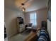 Office space with desk, seating, and natural light from a large window at 5943 River Landings Dr, Raleigh, NC 27616