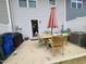 Charming patio area with outdoor dining set and a view of the home's exterior at 5943 River Landings Dr, Raleigh, NC 27616