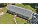 Aerial view shows the home's roof, landscaping, and the driveway at 610 Apple St, Gibsonville, NC 27249