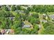 An aerial view of a neighborhood highlighting mature trees, spacious yards, and peaceful residential setting at 610 Apple St, Gibsonville, NC 27249