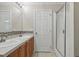 Bathroom with double sinks, neutral color scheme and walk-in shower at 610 Apple St, Gibsonville, NC 27249