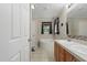 Bathroom with double sinks, ample lighting, and a separate tub at 610 Apple St, Gibsonville, NC 27249