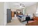 Spacious bedroom features neutral walls, ceiling fan, and multiple windows for natural light at 610 Apple St, Gibsonville, NC 27249