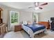 Bedroom with ceiling fan and natural light from large windows at 610 Apple St, Gibsonville, NC 27249