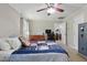 Bedroom with ceiling fan and view into kitchen and fireplace living room at 610 Apple St, Gibsonville, NC 27249